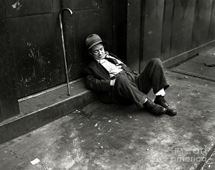 Homeless Man Sleeping On A Sidewalk Photograph by Bettmann