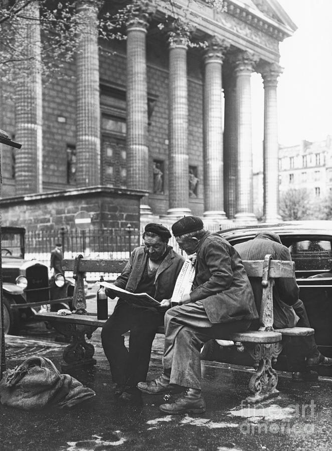 Homeless Men Reading Newspaper Photograph by Bettmann