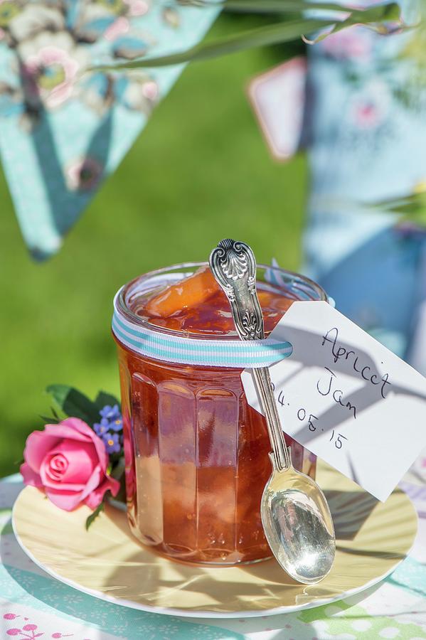 Homemade Apricot Jam In A Jar On A Table Outside Photograph by Winfried Heinze