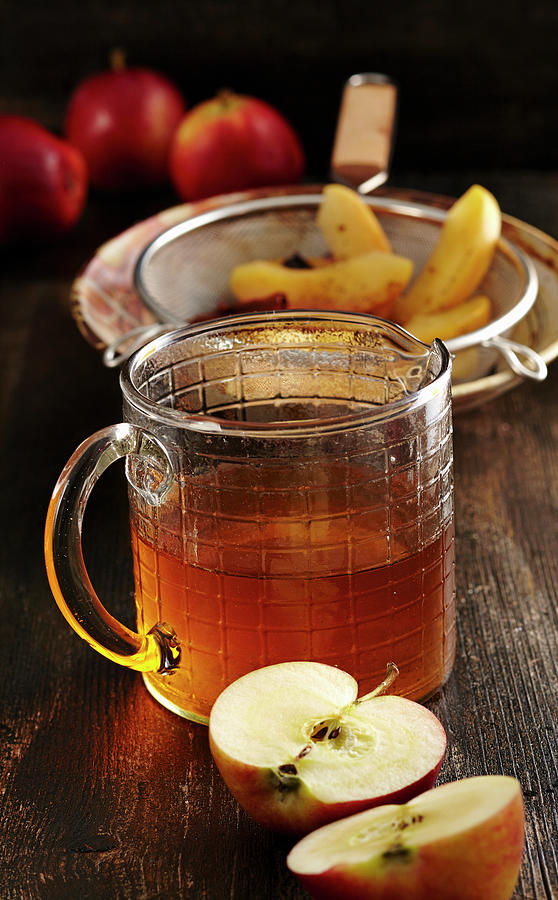Homemade Baked Apple Liqueur With Vanilla, Anise, Cinnamon And Corn Schnapps Photograph by Teubner Foodfoto