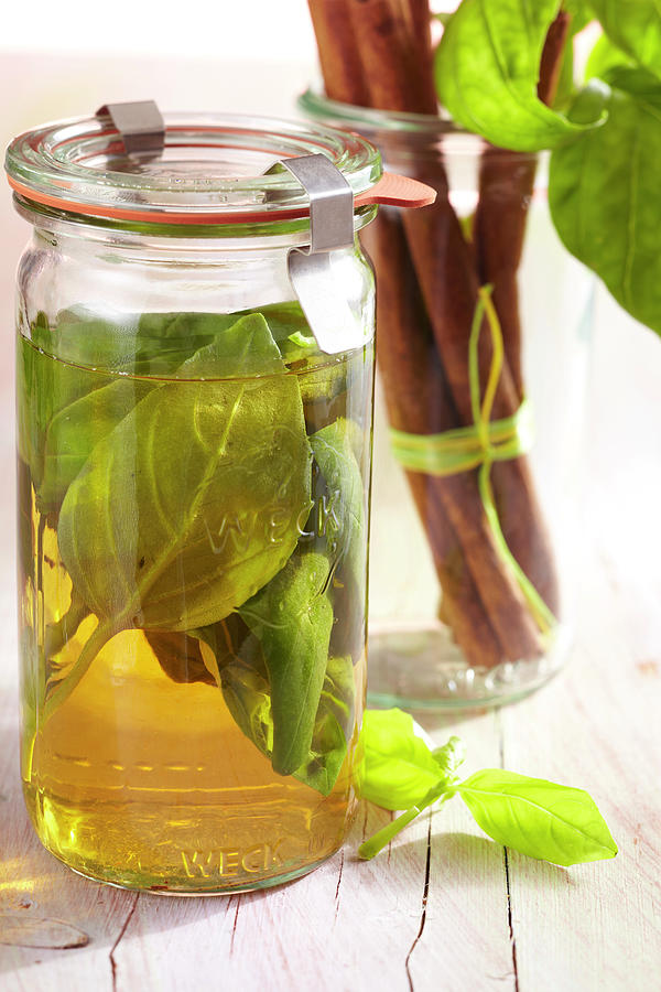 Homemade Basil Spice Vinegar Photograph by Teubner Foodfoto