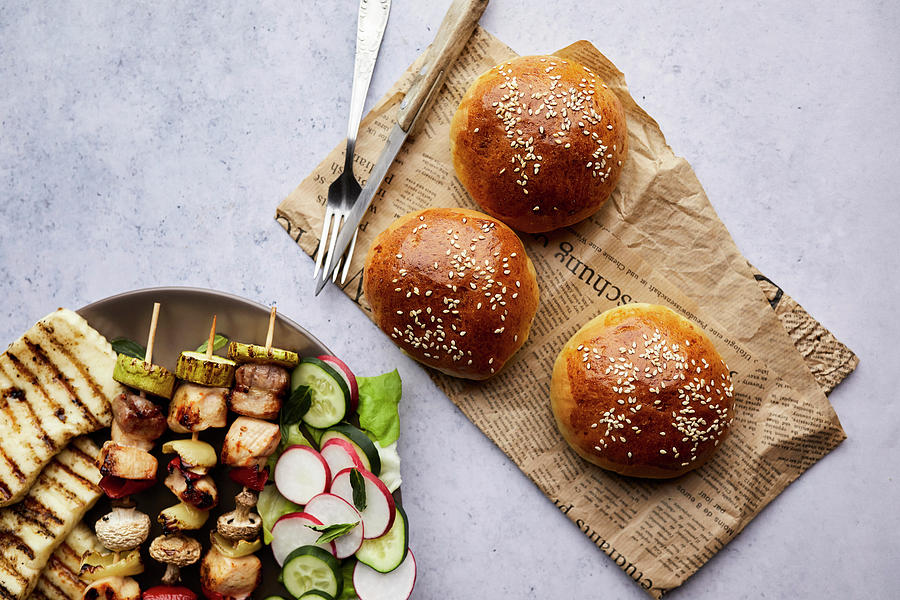 Homemade Bread Buns Served With Chicken Skewers, Grilled Halloumi Cheese And Fresh Salad Photograph by Natasa Dangubic
