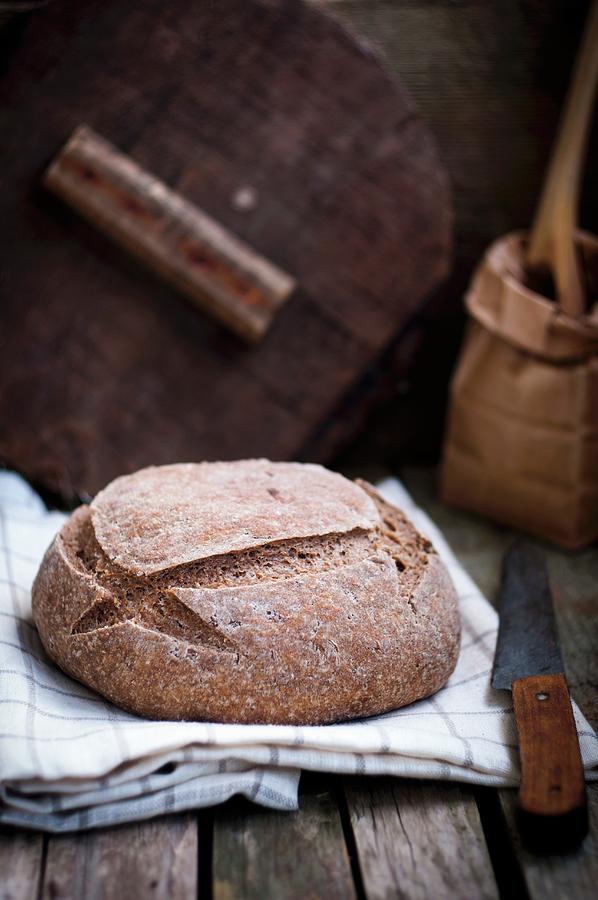 Homemade Bread On A Tea Towel Photograph by Irina Meliukh