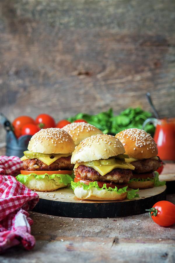Homemade Burgers With Pickled Cucumbers Photograph by Irina Meliukh