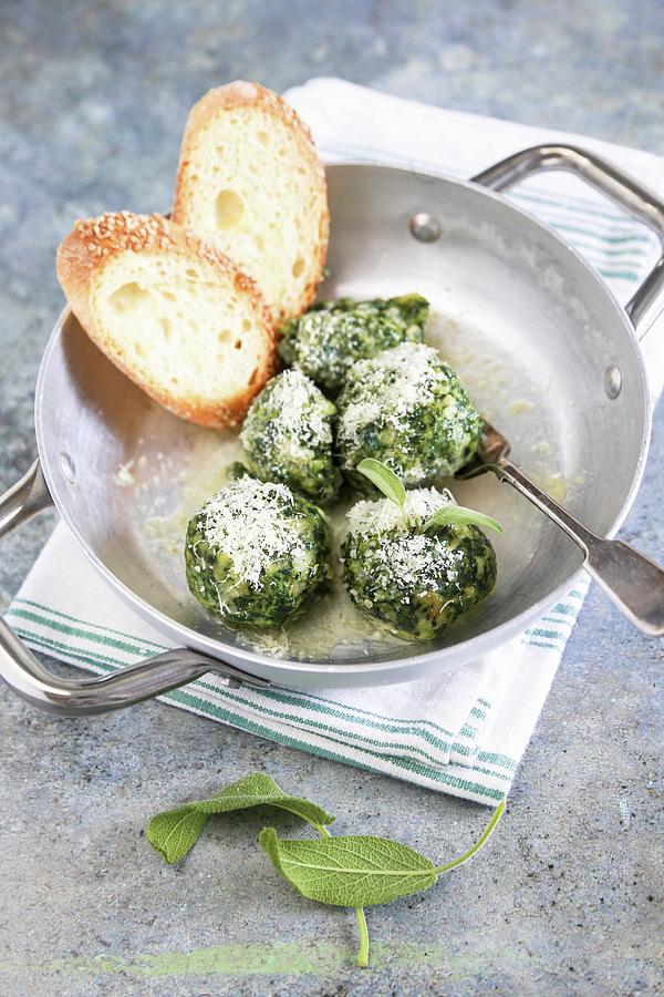 Homemade Canederli With Spinach Served With Butter Sage And Parmesan Cheese Photograph by Claudia Gargioni