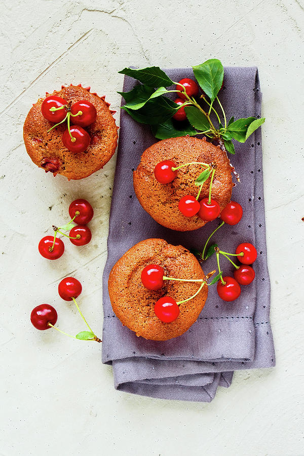 Homemade Cherry Muffins With Sweet Cherry On Concrete Background Photograph by Yuliya Gontar