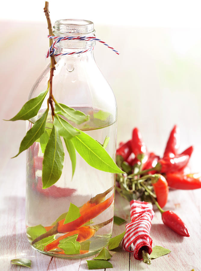 Homemade Chili Sauce With Bay Leaves Photograph by Teubner Foodfoto