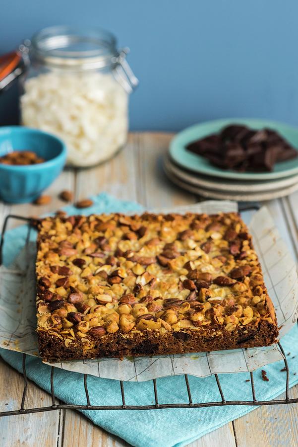 Homemade Choc And Nut Bars On Baking Paper Photograph by Hein Van Tonder