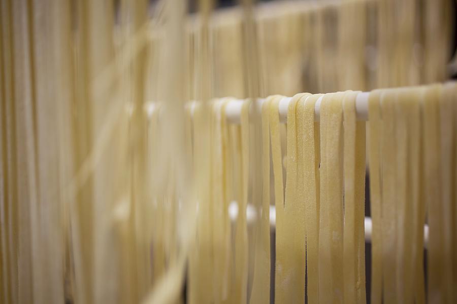 Homemade Fettuccine Drying On A Rack Photograph by Rene Comet