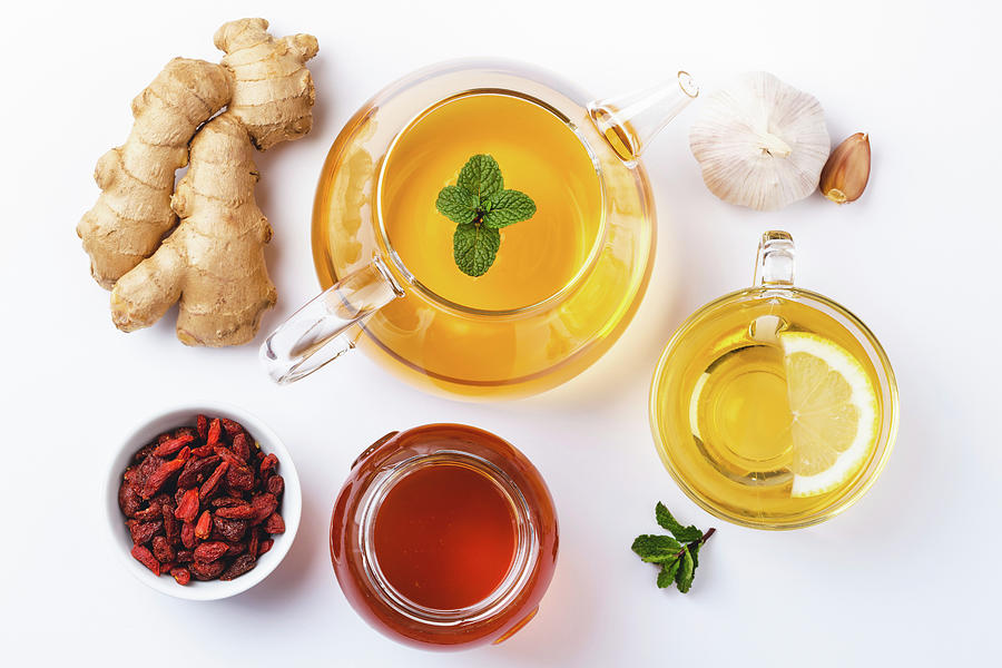 Homemade Ginger And Lemon Tea, Honey, Goji, Garlic, White Background Photograph by Olena Yeromenko
