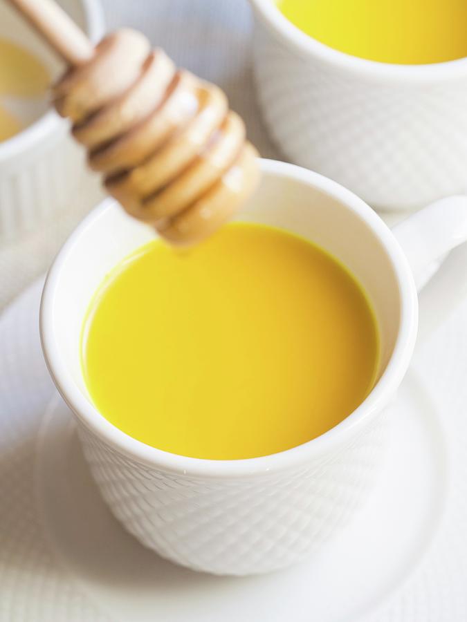 Homemade Golden Milk With Honey Photograph by Magdalena Paluchowska