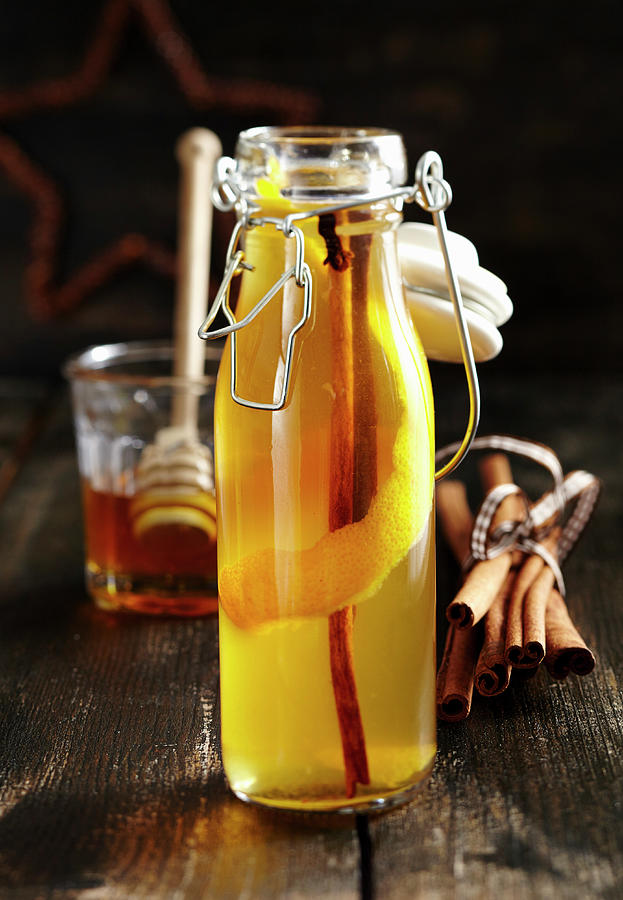 Homemade Honey And Spiced Liqueur With Cinnamon, Cloves And Vodka Photograph by Teubner Foodfoto