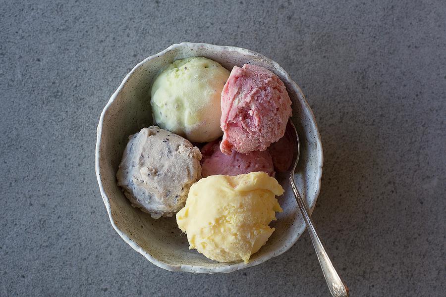 Homemade Ice Cream mango, Strawberry, Blueberry And Lime In A Bowl With A Spoon Photograph by Rose Hewartson