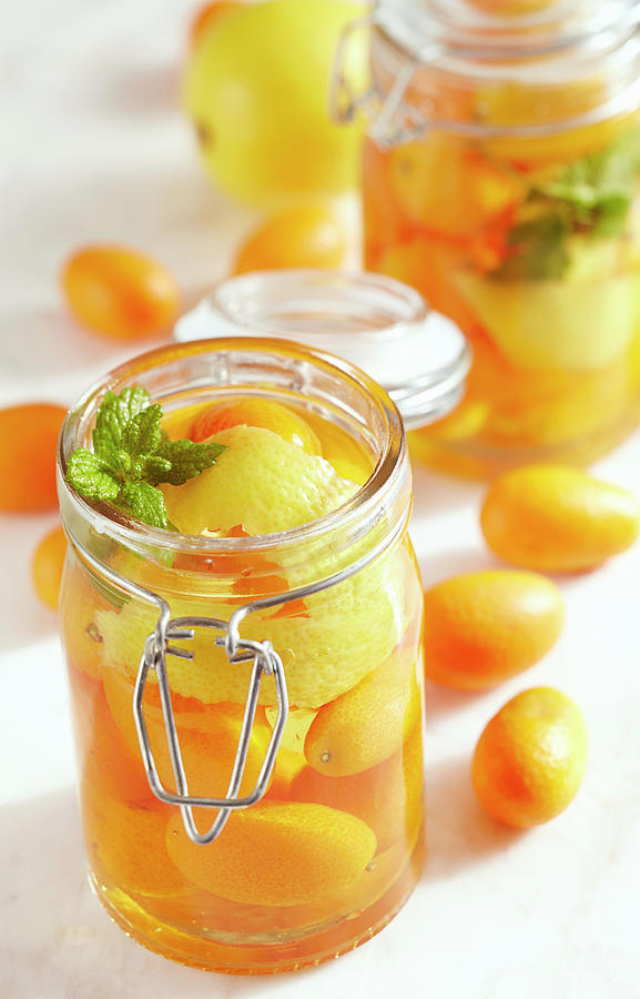 Homemade Kumquat Vinegar In Jars With Whole Fruits, Lemon Zest And Fresh Mint Photograph by Teubner Foodfoto