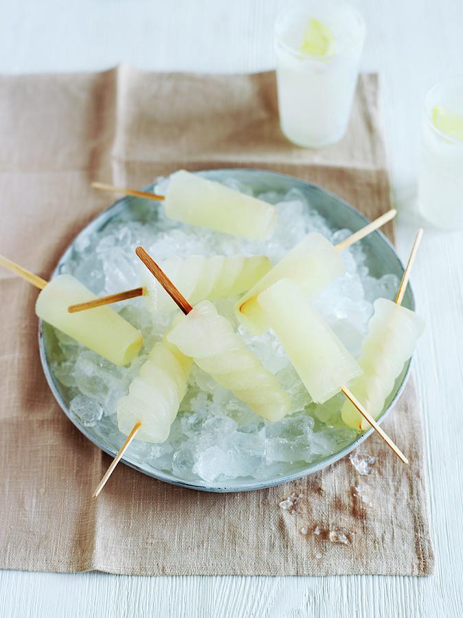 Homemade Lemon And Ginger Ice Lollies Photograph by Charlie Richards