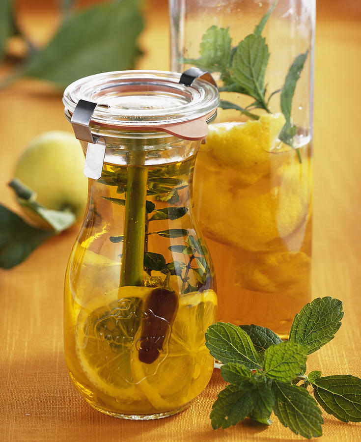 Homemade Lemon Vinegar With Lemon Balm Photograph by Teubner Foodfoto