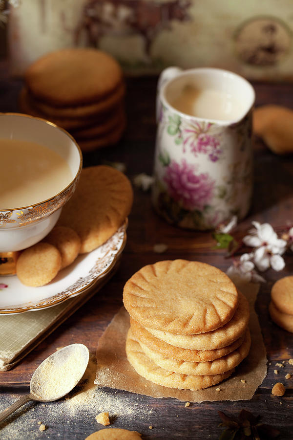 Homemade Malted Milk Biscuits Alongside A Cup Of Tea And A Jug Of Milk Photograph by Jane Saunders