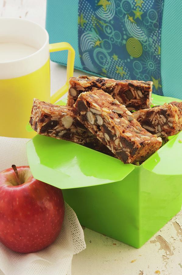 Homemade Muesli Bars To Take Away With An Apple And A Cup Of Milk Photograph by John Hay