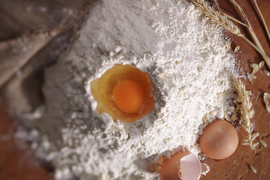Homemade Pasta Ingredients; Egg In A Flour Well Photograph by Frank Weymann