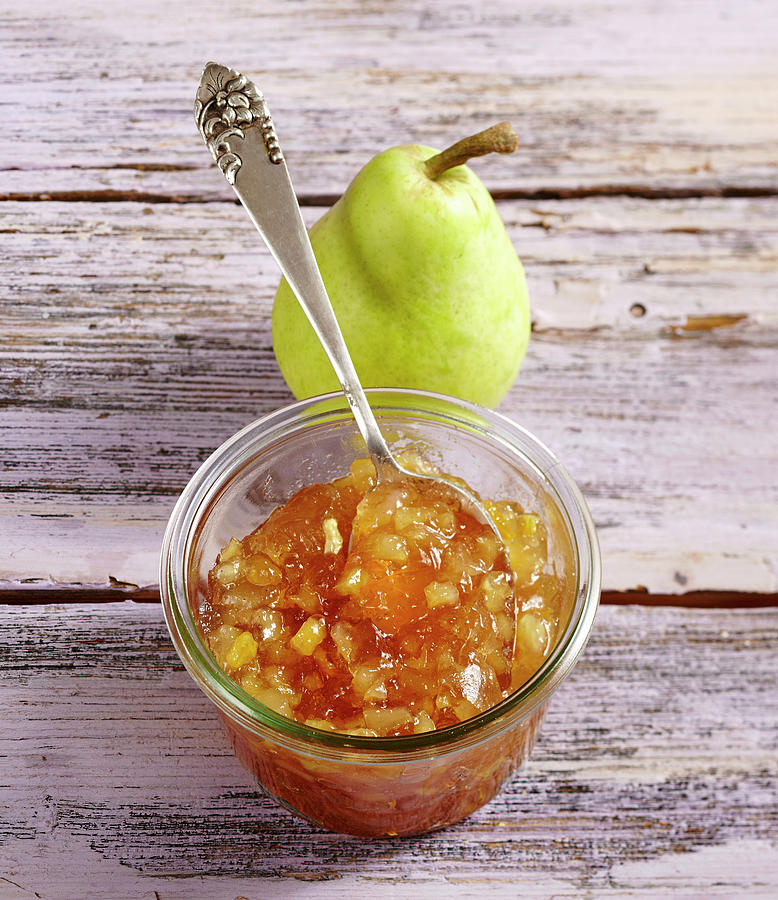 Homemade Pear Jam On A Wooden Background Photograph by Teubner Foodfoto