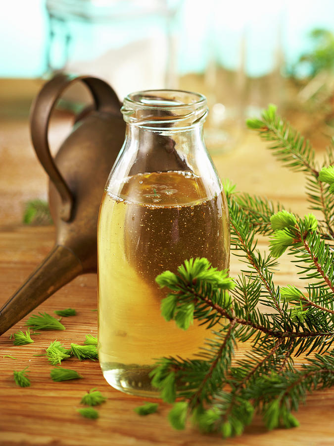 Homemade Pine Syrup In A Glass Bottle With A Vintage Funnel Photograph by Teubner Foodfoto
