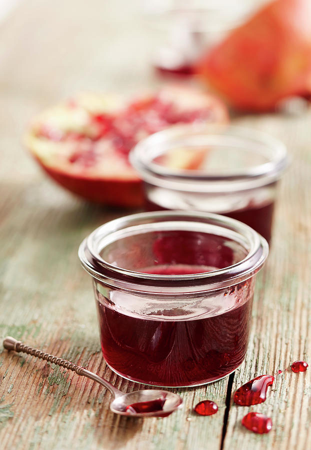 Homemade Pomegranate Syrup In Jars Photograph by Teubner Foodfoto