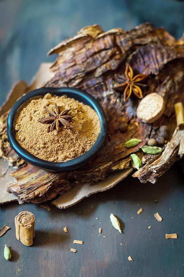 Homemade Pumpkin Pie Spice Mix In Small Bowl On A Tree Bark Photograph by Mateja Zvirotic