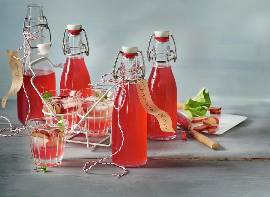 Homemade Rhubarb Syrup In Glasses And Flasks Photograph by Stefan Schulte-ladbeck