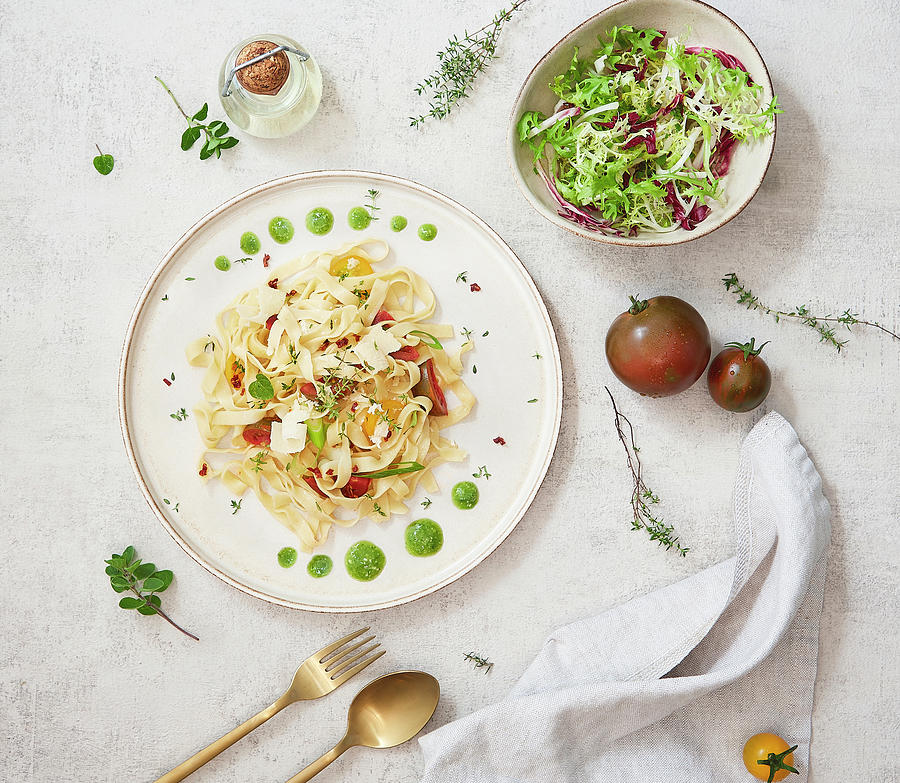 Homemade Ribbon Noodles With Tomatoes, Thyme, Oregano, Leek And Pesto Photograph by Dominik Paunetto