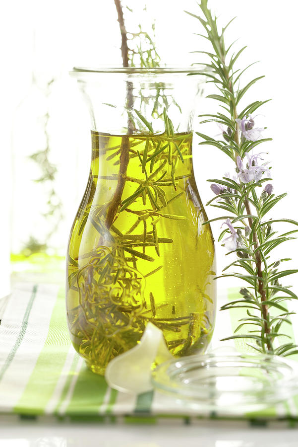 Homemade Rosemary Oil Photograph by Teubner Foodfoto