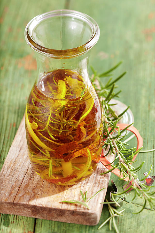 Homemade Rosemary Oil With Dried Tomatoes Photograph by Teubner Foodfoto