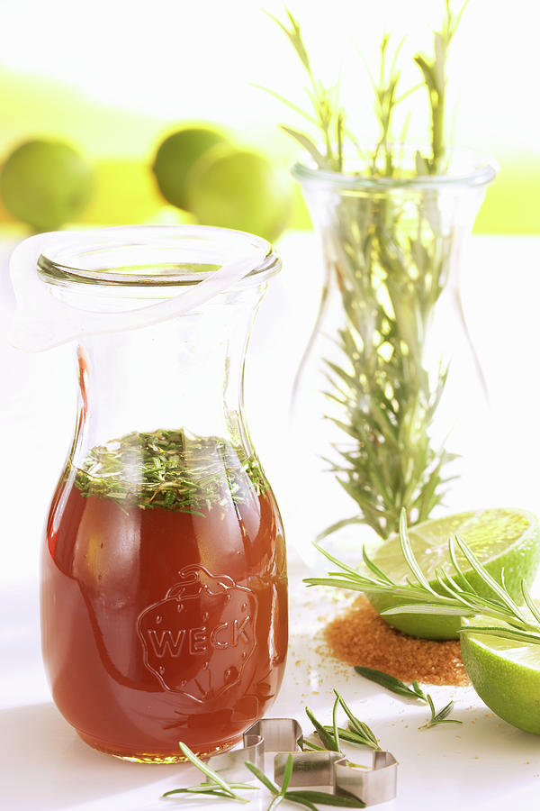 Homemade Rosemary Syrup With Limes And Cane Sugar Photograph by Teubner Foodfoto