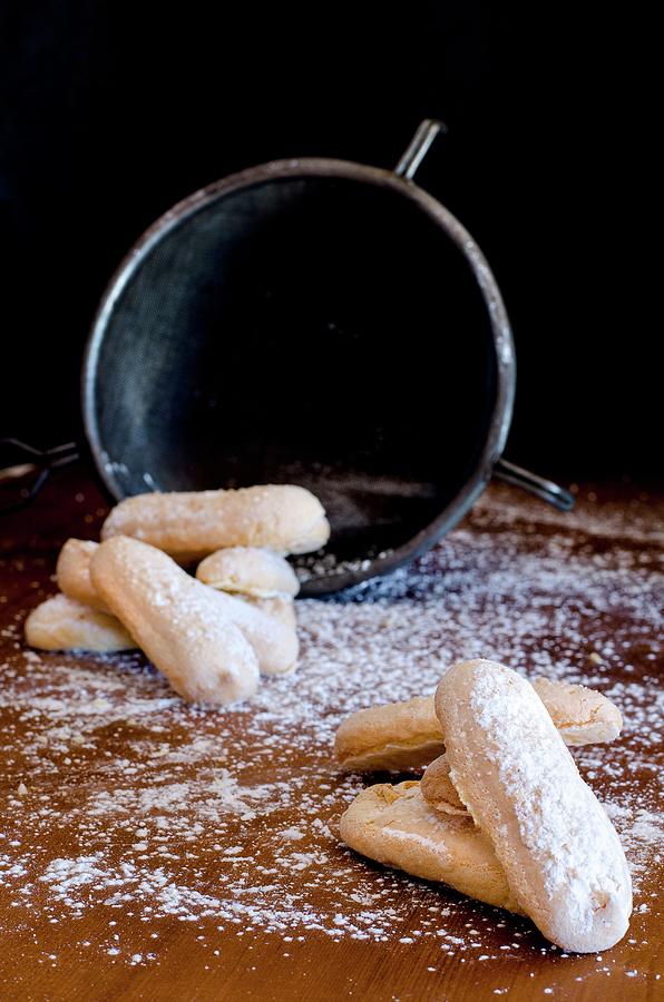 Homemade Sponge Fingers With Icing Sugar Photograph by Jamie Watson