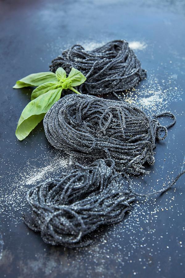 Homemade Squid Ink Spaghetti With Basil Photograph by Liv Friis