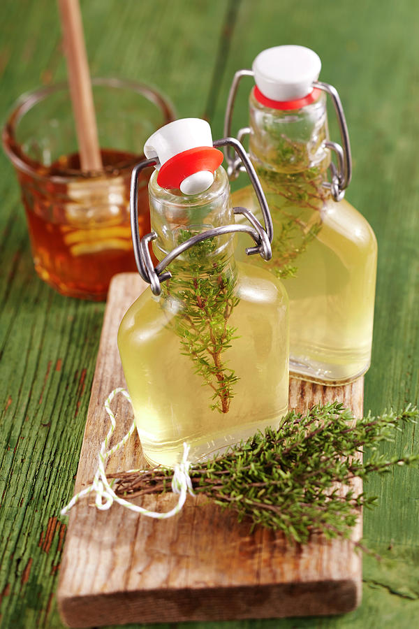 Homemade Thyme Vinegar With Honey In Small Glasses On A Wooden Board Photograph by Teubner Foodfoto