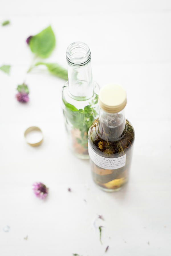 Homemade Wild Herb Oil And Vinegar Photograph by Manuela Rther