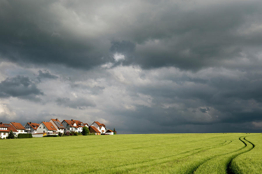 Homes And Grain Field With Winding Tire Photograph by Thomas Winz