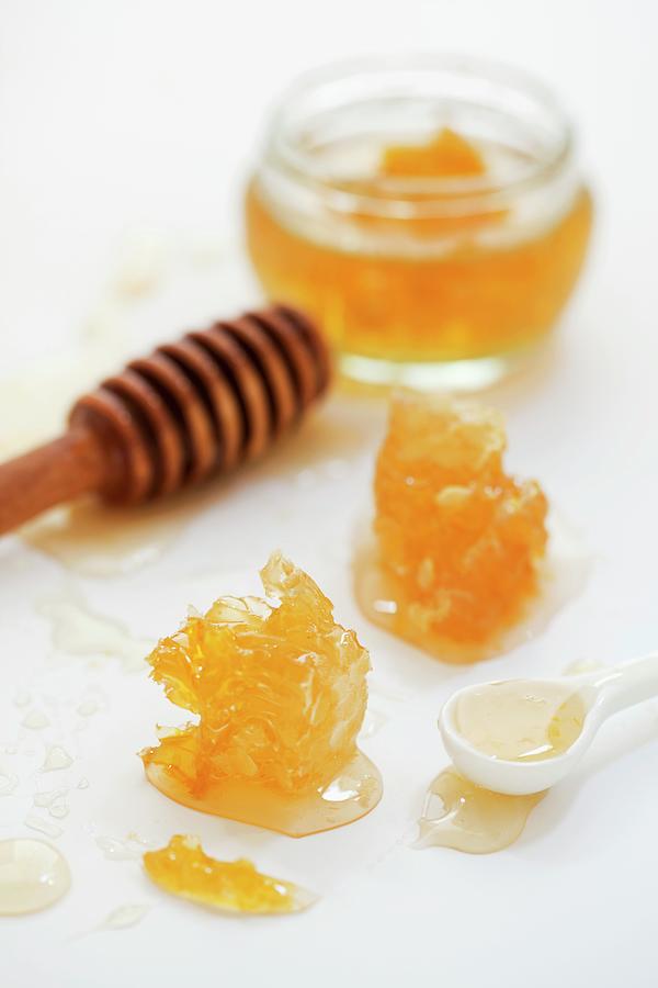 Honey And Honeycomb With A Honey Spoon Photograph by Jane Saunders
