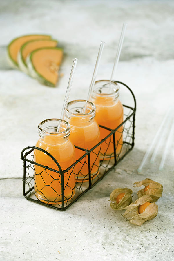 Honey Melon And Physalis Juice In Jar Photograph by Bozena Garbinska