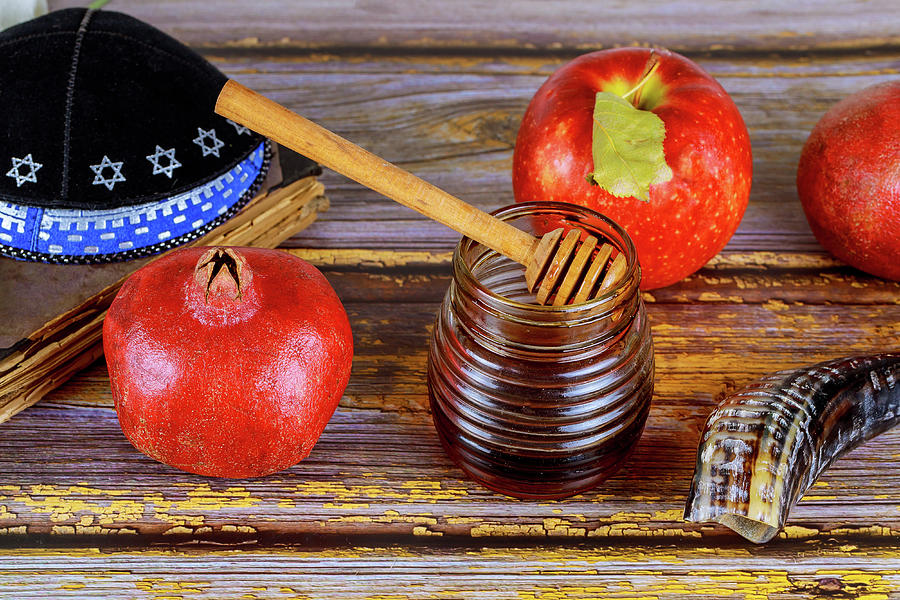 Still Life Photograph - Honey On The Pomegranate And Apples. Jewish New Year Rosh Ha Shana Kippah Yamolka And Shofar by Cavan Images