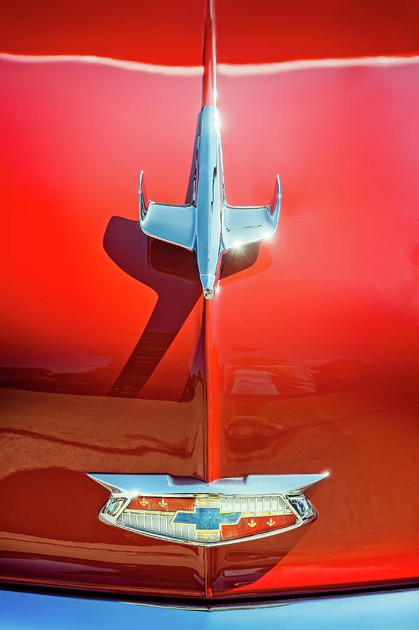 Hood Ornament On A Red 55 Chevy Photograph