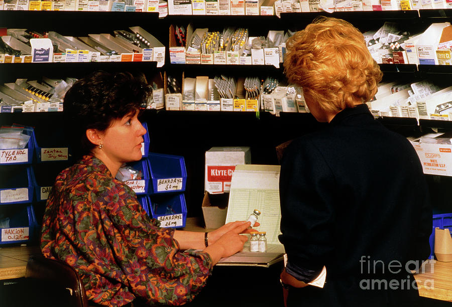Hospital Pharmacist Dispenses A Drug Photograph by John Greim/science Photo Library
