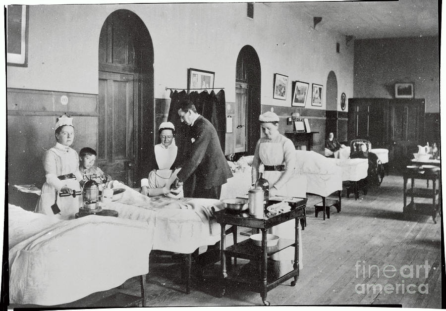 Hospital Scene With Doctor And Nurses Photograph by Bettmann