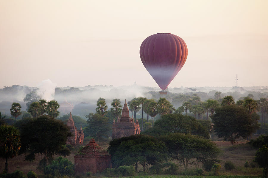 Hot-air Balloon Rising In Bagan Photograph by Wu Swee Ong Hot-air Balloon Rising In Bagan Photograph by Wu Swee Ong