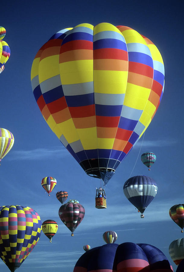 Hot air balloons against blue sky Photograph by Steve Estvanik