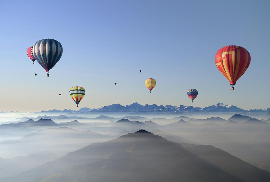 Hot Air Balloons Over Mountain Skyline Photograph by © Axel Lauerer Hot Air Balloons Over Mountain Skyline Photograph by © Axel Lauerer