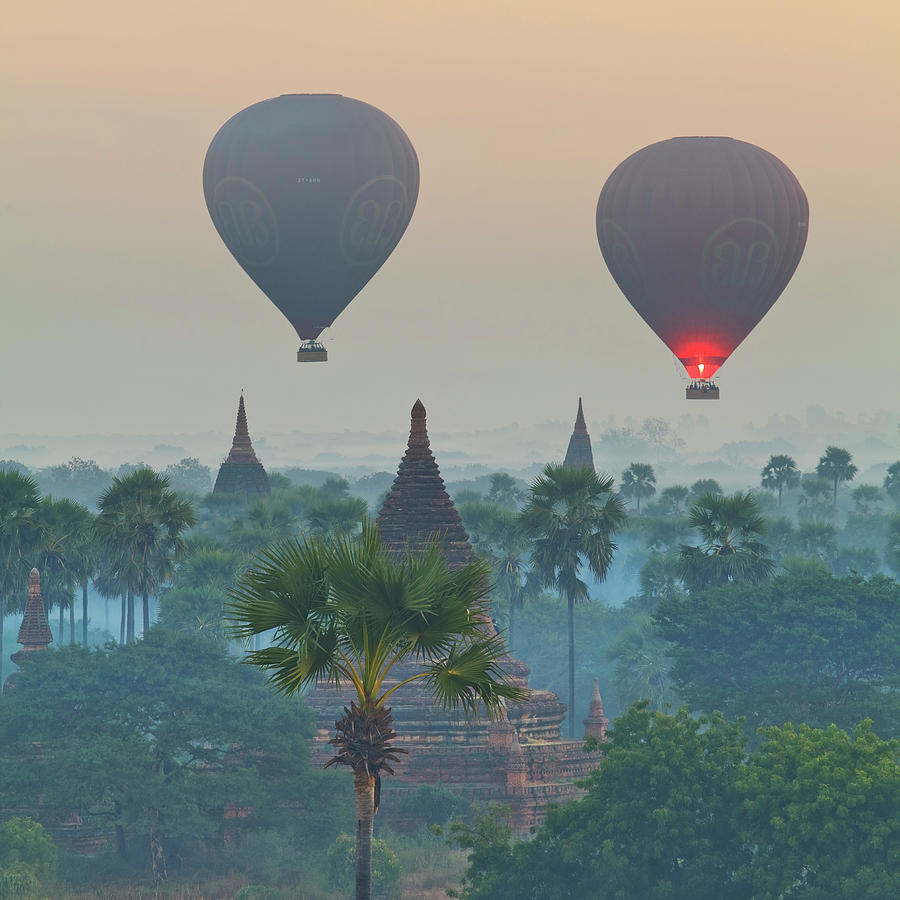 Hot Air Balloons Over Temples, Myanmar Digital Art by Luigi Vaccarella