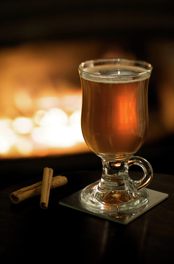Hot Apple Cider By A Fireplace Photograph by Nightanddayimages