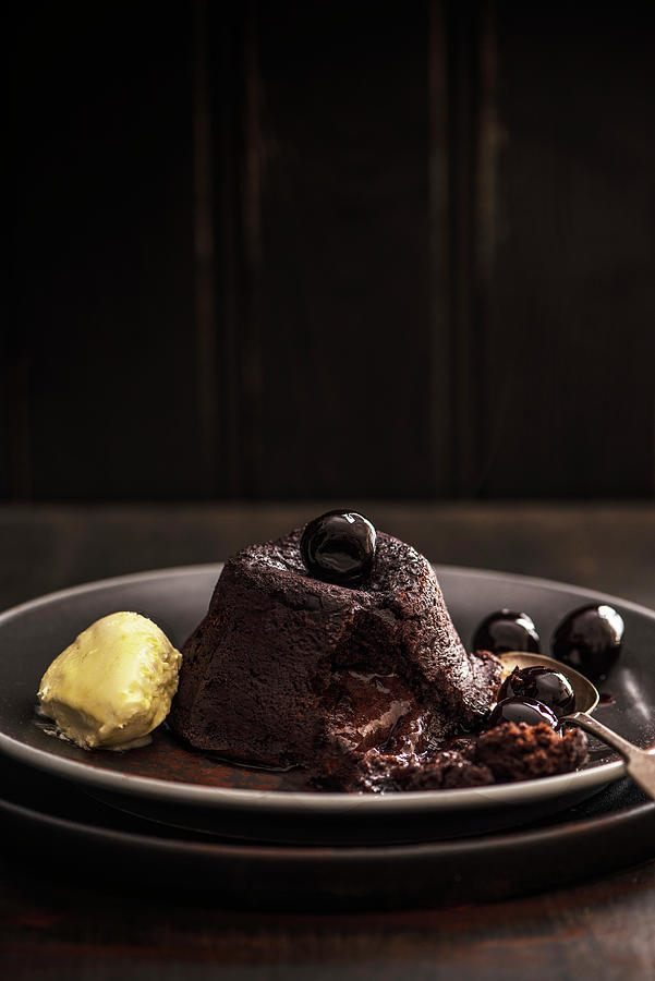Hot Chocolate Fondant With Amaretto Cherries And Clotted Cream Photograph by Magdalena Hendey