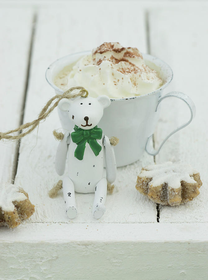 Hot Chocolate With Cream With A Christmas Bear And Cinnamon Biscuits In Front Of It Photograph by Martina Schindler